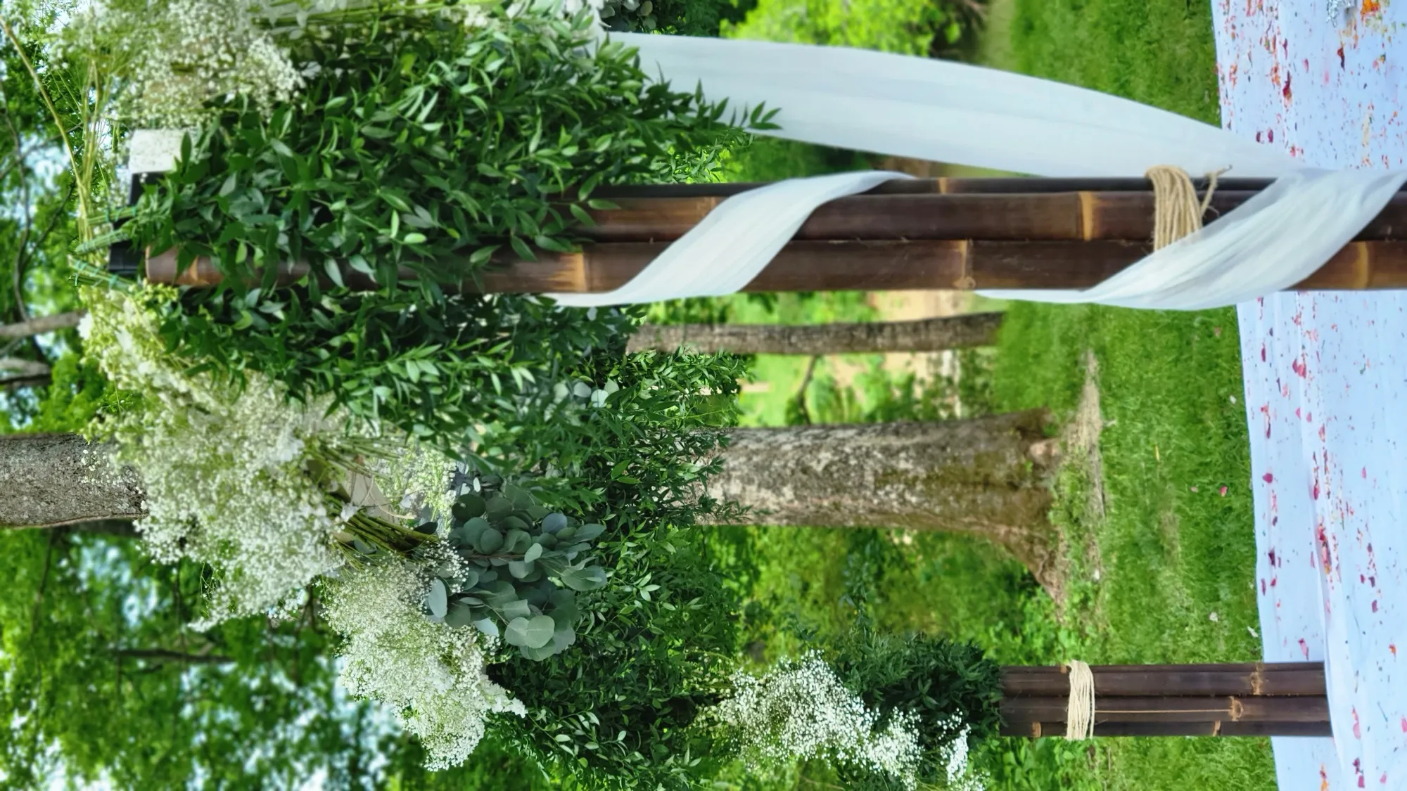 Bamboo post floral detail greenery — Rustic Bamboo Garden Mandap