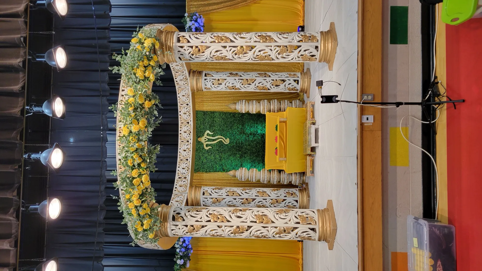 Mandap side angle yellow drapes — Yellow & Gold Mandap with Paisley Pillars