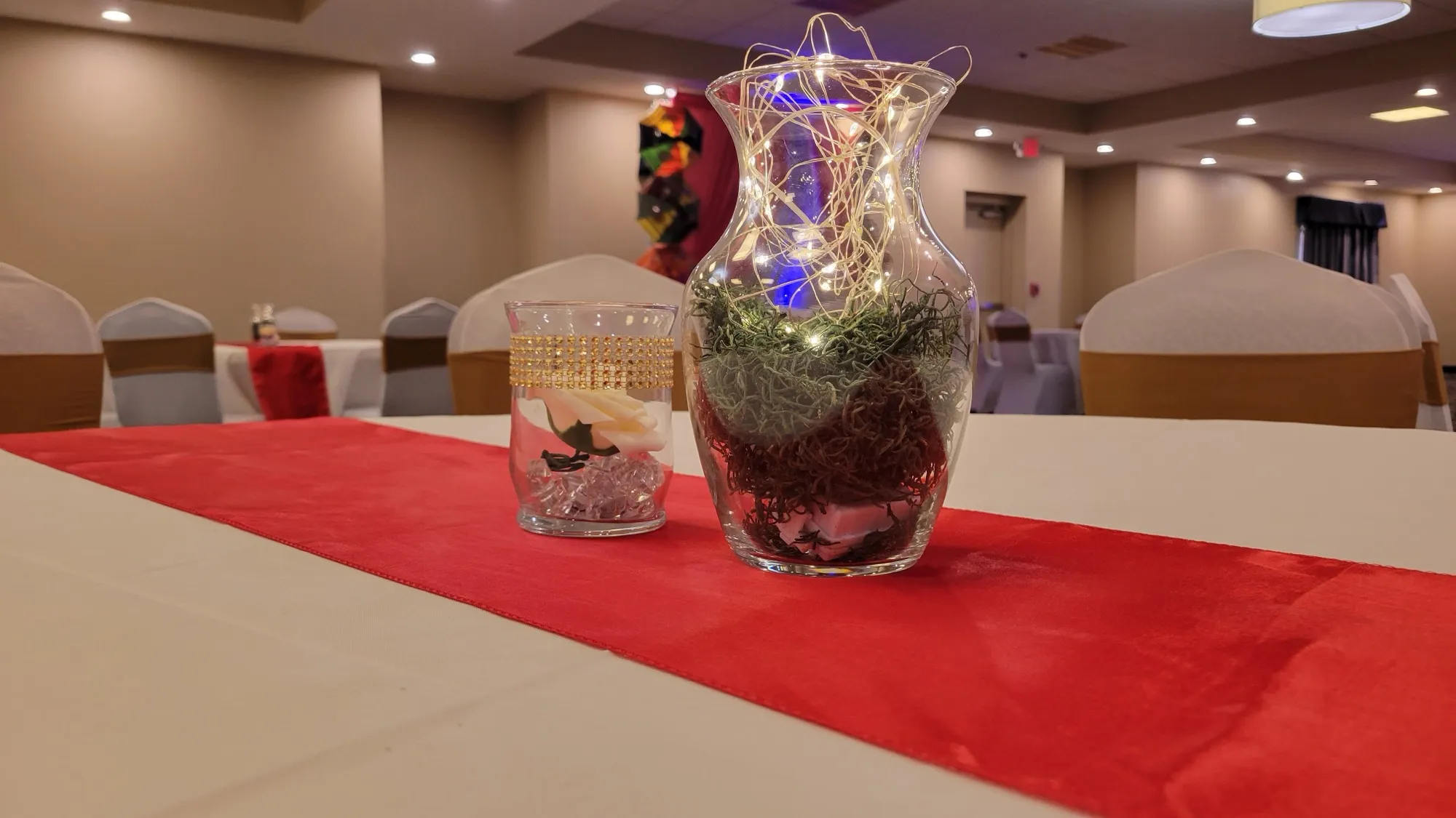 Table centerpiece red runner gold votive — Sequin Drapes & Red Loveseat Reception