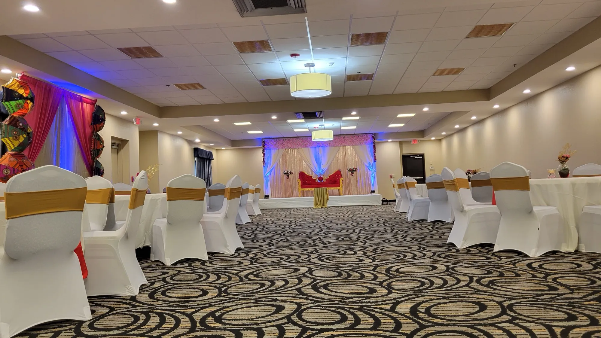 Chair cover gold sash detail — Sequin Drapes & Red Loveseat Reception